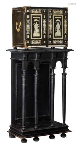 A fine probably Antwerp ebony veneered cabinet-on-stand, with ivory inlaid Renaissance-inspired hunt