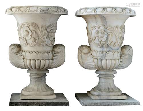 An imposing pair of Oriental-inspired white marble vases, all around decorated with basso-relievo ca