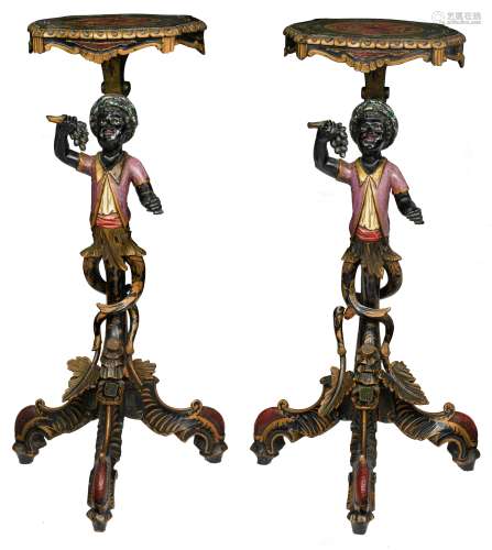 A pair of black lacquered and polychrome painted occasional tables, shaped like two blackamoor figur