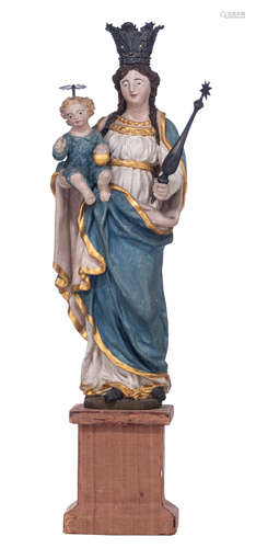 A gilt and polychrome painted wooden Madonna holding the Holy Child, with silver crowns and scepter,