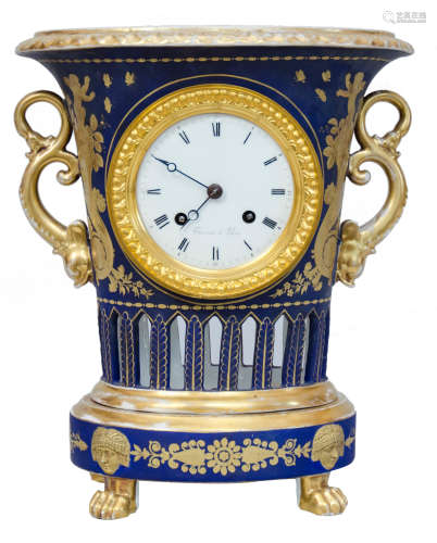 An Empire period bleu royal ground porcelain urn-shaped mantle clock, by the manufactory of Darte Fr
