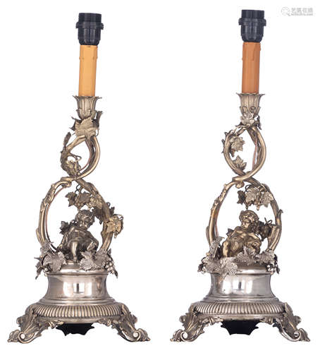 A pair of Belle poque (German?) silver-plated candelabras decorated with Bacchus putti as an allego