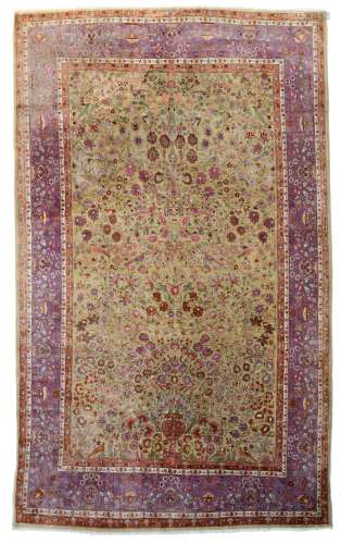 An Oriental silk rug, decorated with a flower vase and birds on flower branches, 223 x 362 cm