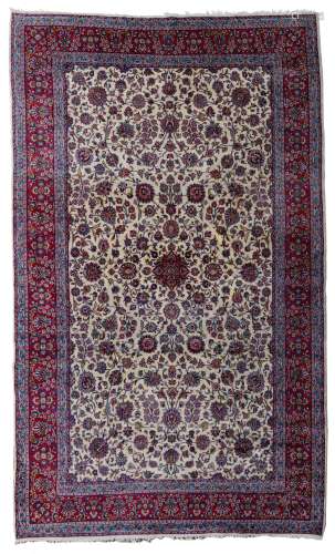 A large Oriental woollen rug, decorated with floral motifs, 505 x 297 cm,