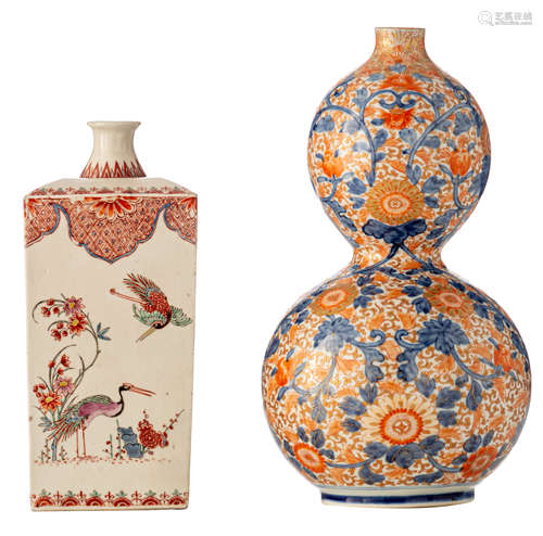 A Japanese Arita Dutch kakiemon decorated sake bottle, each side enamelled with various still lifes