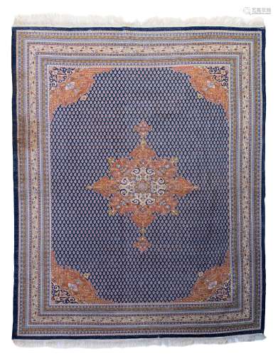 An Oriental rug, decorated with geometric motifs, woollen, 269 x 340 cm