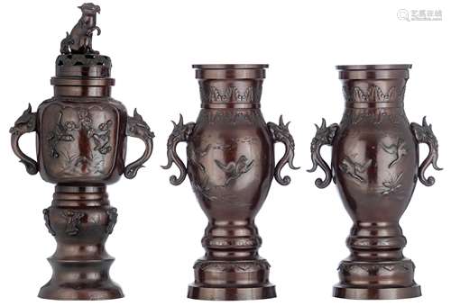 A pair of Chinese bronze vases, decorated with birds cruising amongst clouds, paired with mythical b