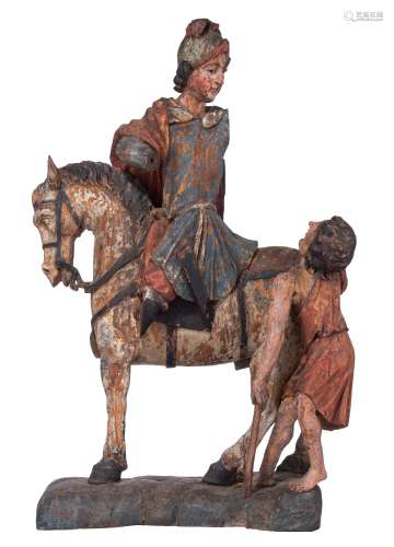 An oak sculpture of Saint Martin, with traces of polychrome paint, 16thC, H 72 - W 46 cm
