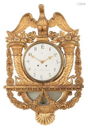 A large carved and gilt wooden Swedish Gustavian wall pendulum, richly decorated with horns of plent