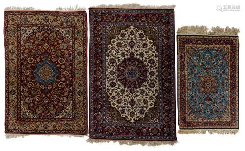 Two Oriental Isfahan rugs with floral motifs. Added a ditto smaller rug with floral motifs and birds