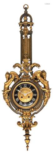 A Napoleon III period gilt bronze cartel clock, decorated with volutes and lion heads, the dial flan