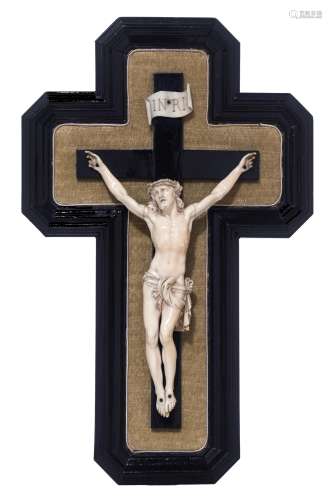 A finely sculpted ivory Corpus Christi on an ebonised rosewood crucifix, 19thC, H 21 - W 13,5 cm (th