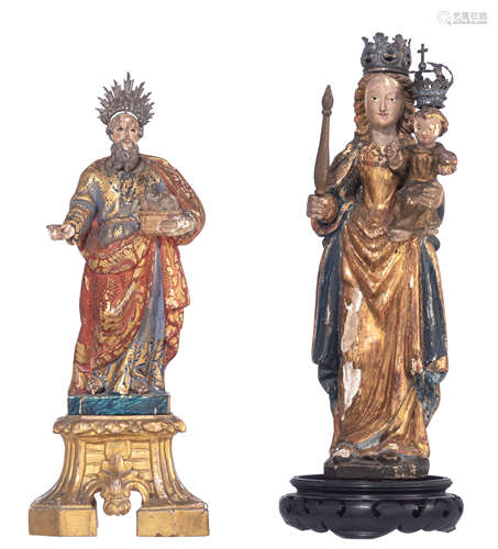 A fine polychrome and gilt painted lime sculpture of Saint Cajetan, on an imitation marble base, on