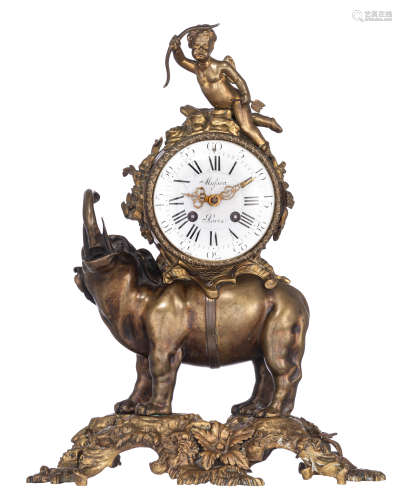 A patinated bronze mantle clock, with an elephant carrying the clock on his back with on top a cupid