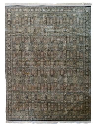 An Oriental silk rug, decorated with geometrical motifs, 269,5 x 360 cm