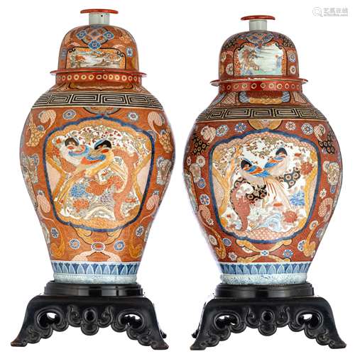 Two Japanese Arita covered vases in Imari pattern, the central panel decorated with a couple of phea