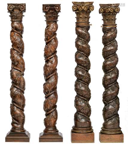 Two pair of richly carved oak and walnut Solomonic columns with a Corinthian capital, decorated with