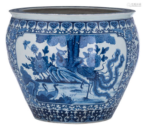 A Chinese blue and white cachepot, the panels decorated with birds and flower branches, with a Kangx