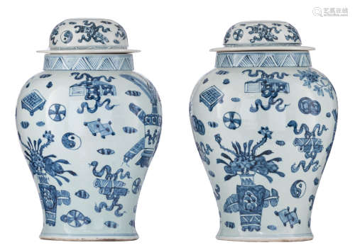 A pair of Chinese blue and white covered vases, decorated with flower baskets and antiquities, 20thC