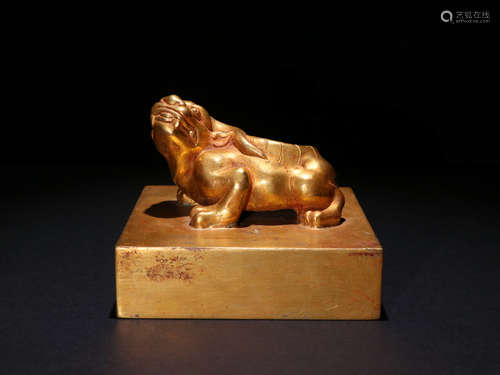 A GILT-BRONZE BEAST SEAL