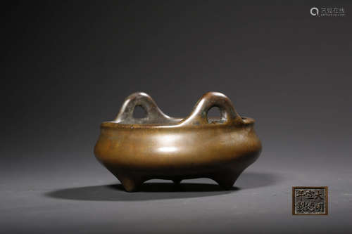 A BRONZE TRIPOD CENSER