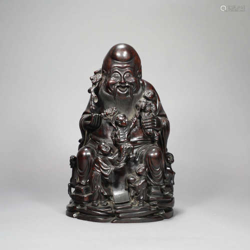 A RED SANDALWOOD CARVED FIGURE STATUE