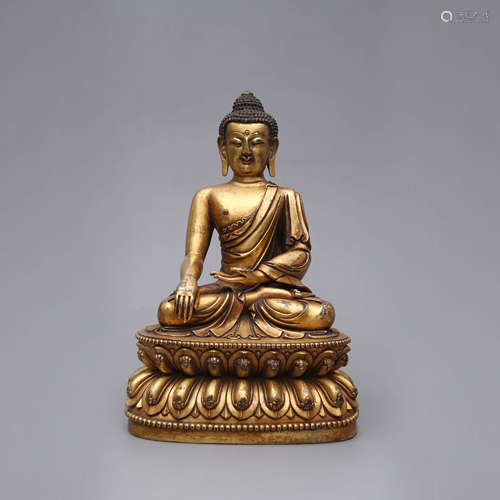 A Gilt Bronze Figure of Buddha Shakymuni