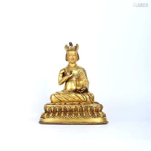 A Gilt bronze figure of Lama