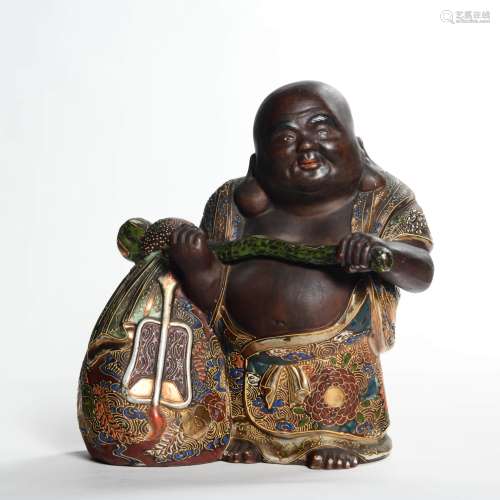 A Carved Porcelain Monk