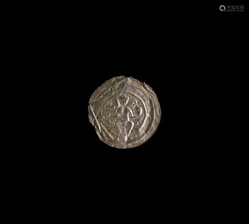 Medieval Silver Bracteate with Seated Figure