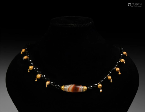 Garnet and Gold Necklace with Agate Bead