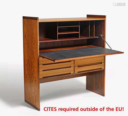 DROP WRITING CABINET. Mid. 20th c. Danish design. Walnut and rosewood. Inside compartments, table leaf with grey leather. Beneath six drawers. H.118cm, 108x43cm. Condition B/C. One fitting of the table leaf damaged.