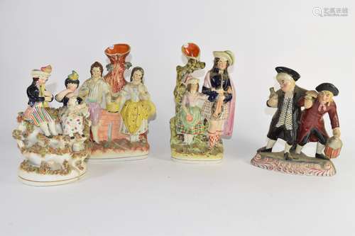 Group of Staffordshire porcelain figures including The Night Watchman and group of figures in