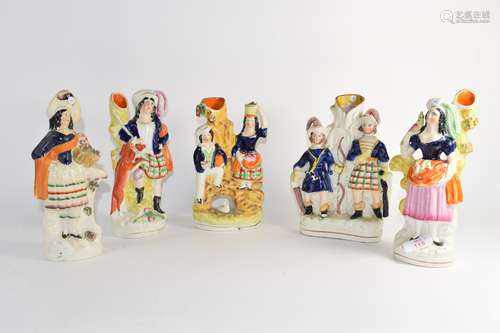 Group of five Staffordshire spill holder figures mainly in Highland dress (5)