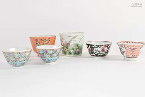 Group of Chinese porcelain tea bowls including a coral ground tea bowl with floral decoration and