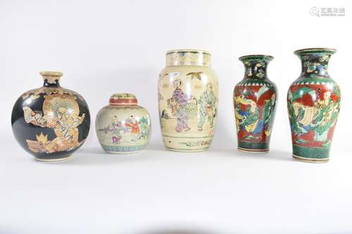 Group of Oriental pottery wares including a large vase with figures, further pair of vases with