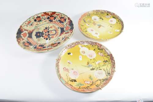 Pair of Japanese Satsuma ware plates with floral decoration and a further Imari style dish (3)