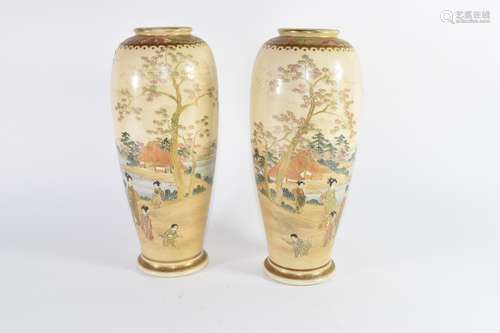 Pair of cylindrical Satsuma ware vases decorated with Japanese figures in landscapes (2)