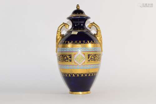 Late 19th century Vienna style porcelain vase and cover, the blue ground with gilt bordered oval