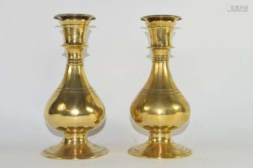 Two brass baluster shaped candlesticks