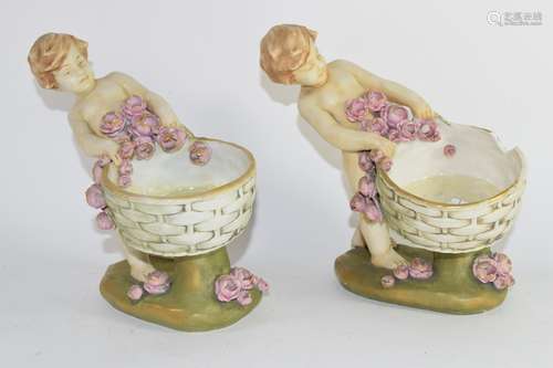 Pair of Austrian amphora figures of children holding baskets, one with restoration (2)