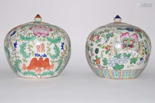 Two Chinese porcelain jars and covers decorated in polychrome with floral design (2)