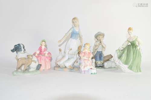 Group of Lladro style figures of a goose girl, puppies, Royal Doulton figures of Curly Locks and