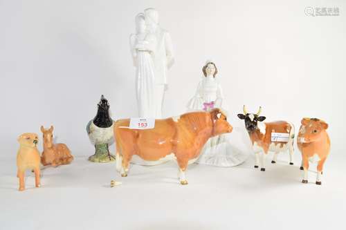 Group of Beswick wares including three bulls and calf, figure of a lapwing and Royal Doulton figures