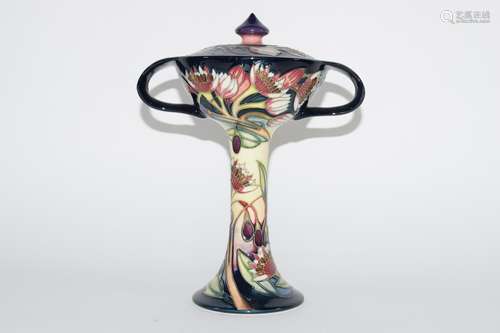 Modern Moorcroft vase and cover in Art Nouveau shape, decorated with tube lined flowers, the base