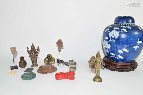 Chinese porcelain ginger jar and cover, the blue ground decorated with prunus, together with other