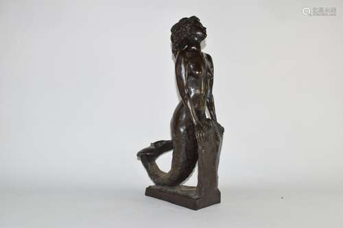 20th century bronzed composition model of a mermaid leaning on a rock, 45cm high