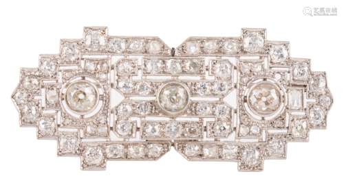 An 18ct white gold Art Deco style brooch set central with three bigger brilliant-cut diamonds and furthermore all-over set with ditto smaller diamonds, W 6 cm, the total weight 16,5 g