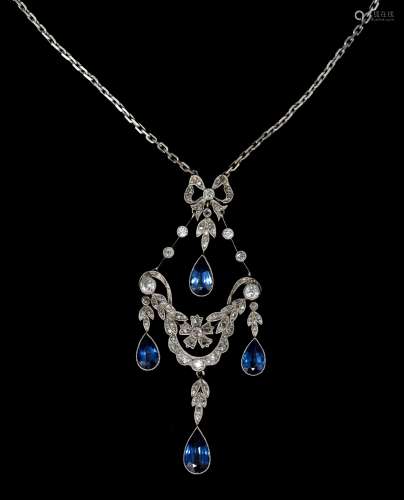 A Victorian sapphire and diamond pendant, the openwork panel set with rose- and brilliant-cut diamonds and four suspending pear-shaped sapphires and pending on an 18ct white gold cable chain - in its original Elkingto...