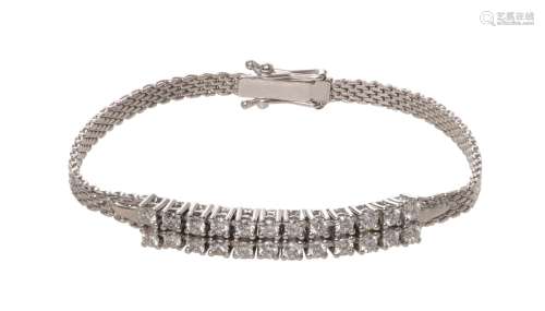 An 18ct white gold bracelet set with 24 brilliant-cut diamonds, L 15,5 cm, the total weight 9,7 g